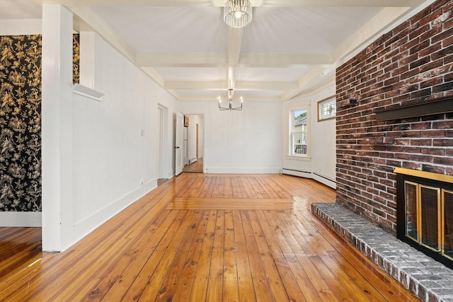 67-69 Nesmith St, Lawrence, MA 01841 - unfurnished living room featuring a baseboard radiator, a chandelier, hardwood / wood-style floors, a fireplace, and beamed ceiling