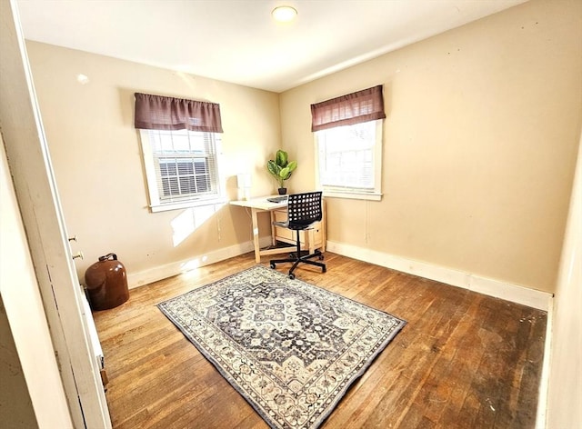 office area with hardwood / wood-style floors and a wealth of natural light