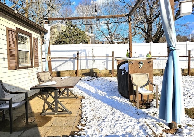 view of snow covered patio