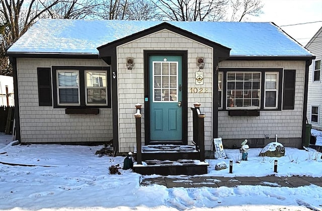 view of snow covered property entrance