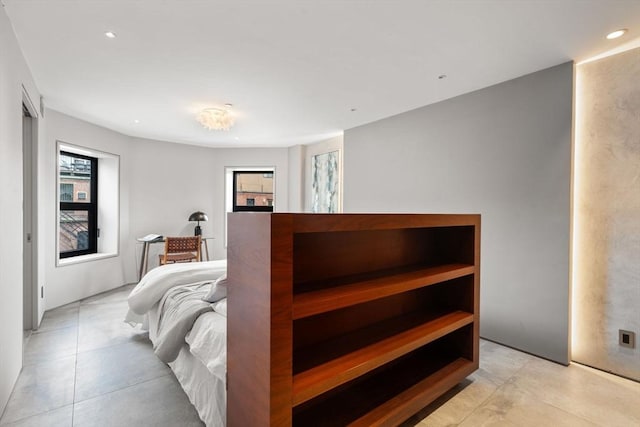 bedroom with recessed lighting and light tile patterned flooring