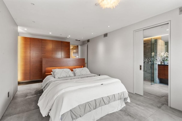 bedroom featuring recessed lighting and concrete flooring