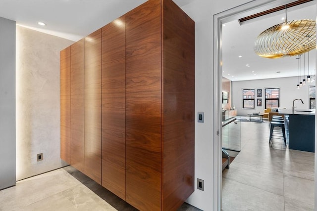 hall featuring recessed lighting