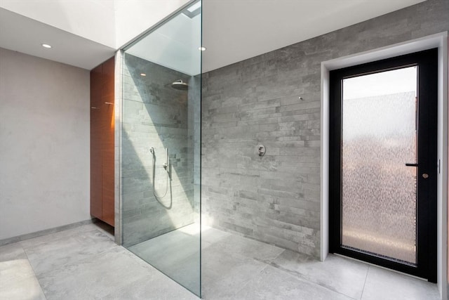 bathroom with a walk in shower and recessed lighting