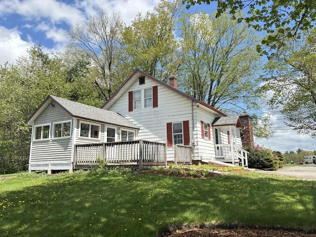 45 Gardner Rd, Hubbardston, MA 01452 - view of front facade with a chimney, a front lawn, roof with shingles, and a wooden deck