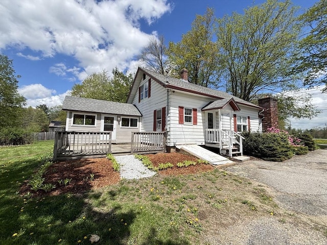 45 Gardner Rd, Hubbardston, MA 01452 - rear view of house featuring a chimney, a deck, a lawn, and a shingled roof