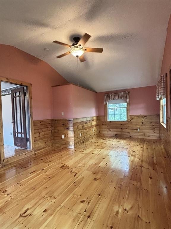 45 Gardner Rd, Hubbardston, MA 01452 - spare room featuring vaulted ceiling, a wainscoted wall, hardwood / wood-style floors, ceiling fan, and healthy amount of natural light