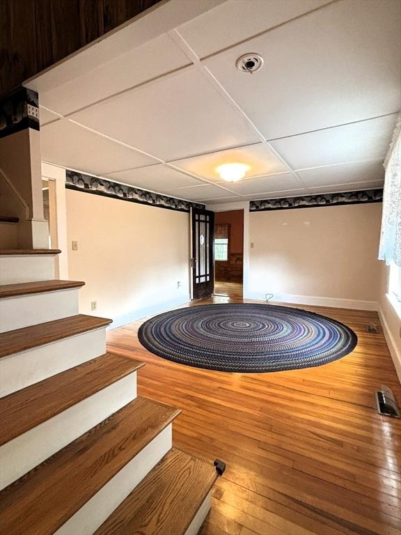 45 Gardner Rd, Hubbardston, MA 01452 - stairway featuring hardwood / wood-style floors, healthy amount of natural light, and baseboards