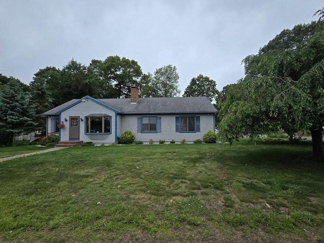 6 Nevada, Freetown, MA 02702 - view of front of property featuring a chimney, a front lawn, and brick siding