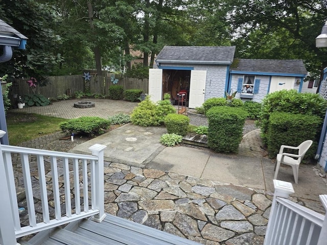 6 Nevada, Freetown, MA 02702 - view of patio / terrace featuring a storage unit and a fire pit