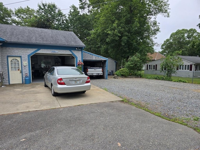 6 Nevada, Freetown, MA 02702 - view of home's exterior featuring driveway, a shingled roof, an attached garage, and a carport