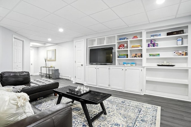 134 Lincoln St, Norwell, MA 02061 - living area with dark wood-type flooring, recessed lighting, a paneled ceiling, and a baseboard radiator