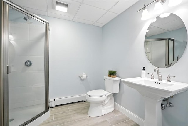 134 Lincoln St, Norwell, MA 02061 - full bath featuring baseboard heating, a drop ceiling, a shower stall, and wood finish floors