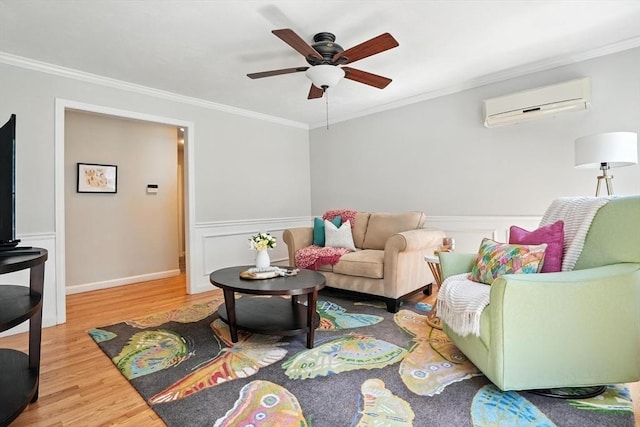134 Lincoln St, Norwell, MA 02061 - living area with an AC wall unit, crown molding, wood finished floors, ceiling fan, and wainscoting