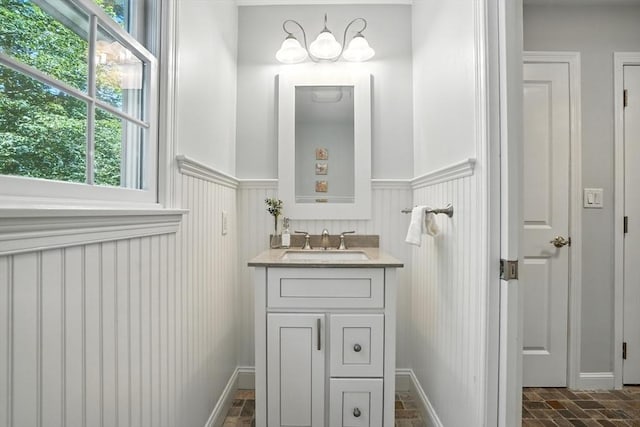 134 Lincoln St, Norwell, MA 02061 - bathroom featuring vanity, brick patterned flooring, and wainscoting