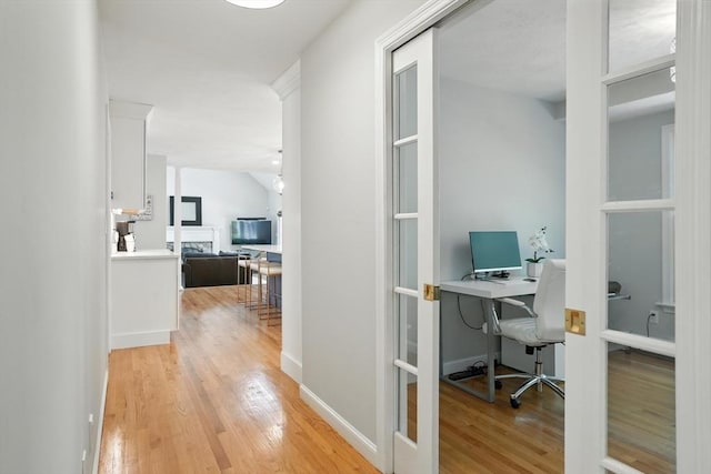 134 Lincoln St, Norwell, MA 02061 - office area with light wood-type flooring and french doors