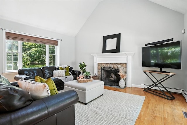 134 Lincoln St, Norwell, MA 02061 - living area with high vaulted ceiling, light wood-style flooring, a baseboard radiator, and a fireplace