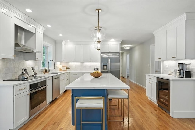 134 Lincoln St, Norwell, MA 02061 - kitchen with appliances with stainless steel finishes, wall chimney exhaust hood, wine cooler, backsplash, and recessed lighting