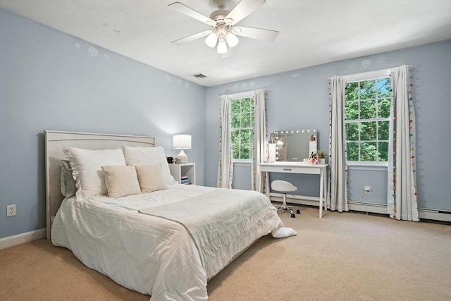 134 Lincoln St, Norwell, MA 02061 - carpeted bedroom with a ceiling fan and a baseboard heating unit