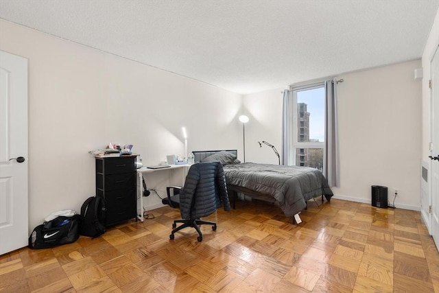 bedroom featuring baseboards
