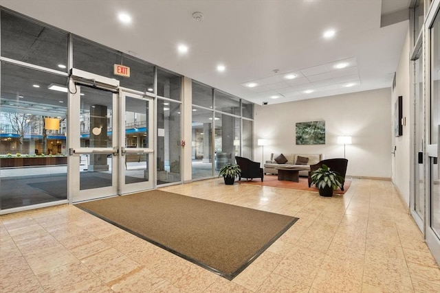 common area with recessed lighting and floor to ceiling windows