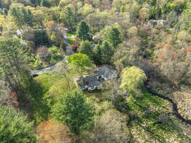 aerial view featuring a wooded view