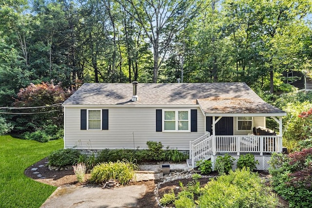 117 Woodland Dr, Lunenburg, MA 01462 - view of front of property featuring a porch, roof with shingles, and a front yard