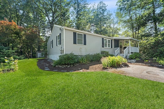 117 Woodland Dr, Lunenburg, MA 01462 - manufactured / mobile home featuring a front lawn and covered porch