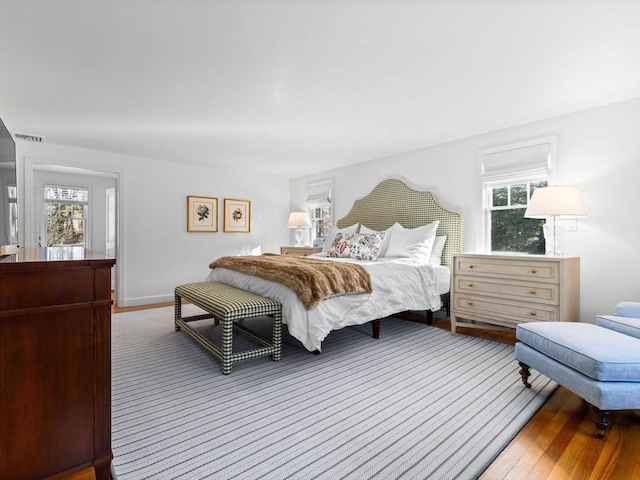 bedroom with wood-type flooring