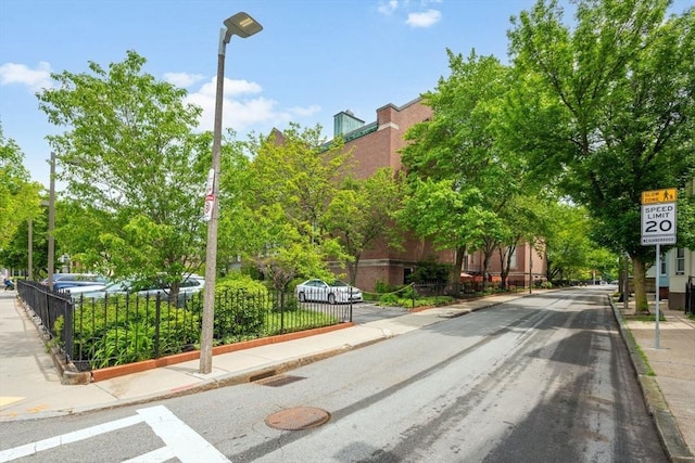 743 E 4th Unit 204, Boston, MA 02127 - view of asphalt road featuring sidewalks, curbs, traffic signs, and street lights