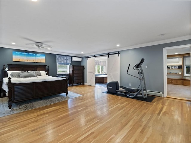 886 Methuen St, Dracut, MA 01826 - bedroom featuring a barn door, an AC wall unit, light wood-style flooring, crown molding, and recessed lighting