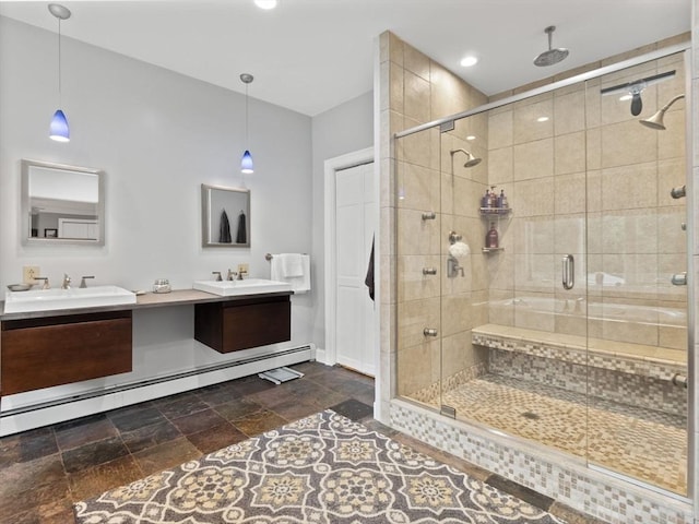 886 Methuen St, Dracut, MA 01826 - bathroom with double vanity, a baseboard heating unit, a stall shower, and stone tile floors