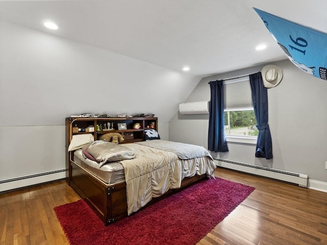 886 Methuen St, Dracut, MA 01826 - bedroom featuring baseboard heating, vaulted ceiling, a wall mounted AC, wood finished floors, and recessed lighting