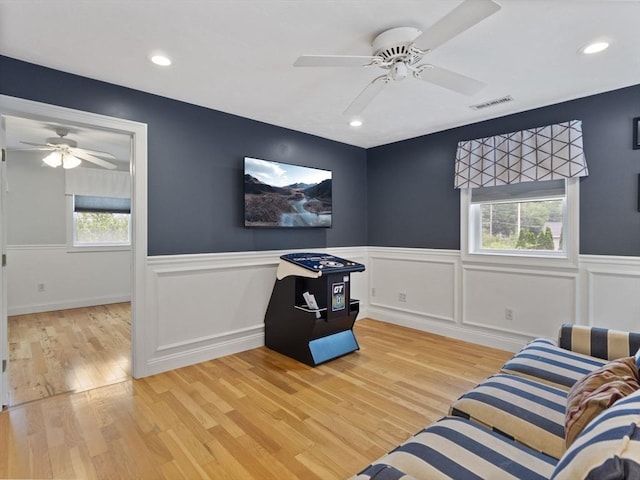 886 Methuen St, Dracut, MA 01826 - sitting room with ceiling fan, plenty of natural light, light wood-type flooring, wainscoting, and recessed lighting