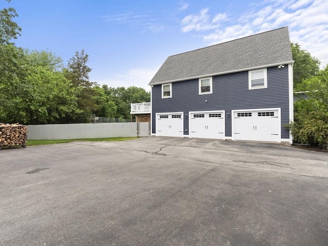 886 Methuen St, Dracut, MA 01826 - view of side of home featuring driveway and a shingled roof