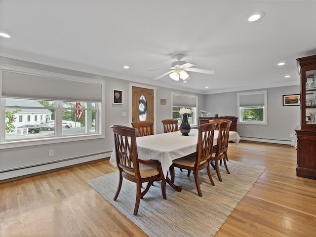 886 Methuen St, Dracut, MA 01826 - dining area with a baseboard heating unit, crown molding, a ceiling fan, light wood-style flooring, and baseboard heating