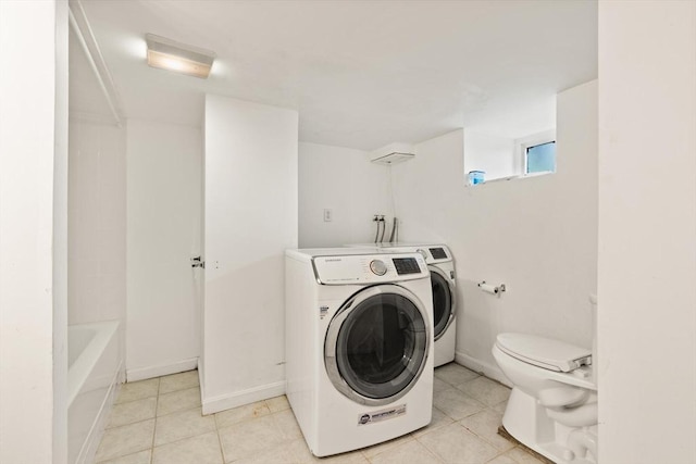 23 Gordon St, Boston, MA 02134 - laundry area with hookup for a washing machine, light tile patterned flooring, and baseboards