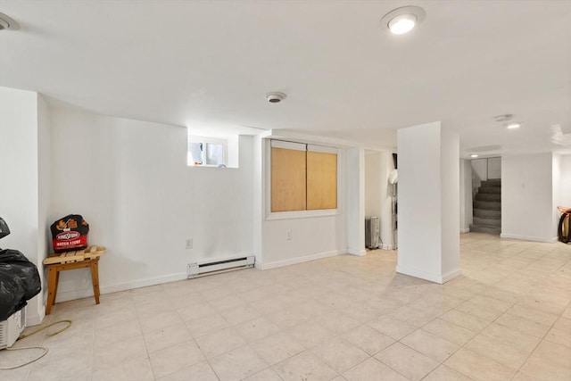23 Gordon St, Boston, MA 02134 - below grade area with baseboard heating, stairway, and baseboards