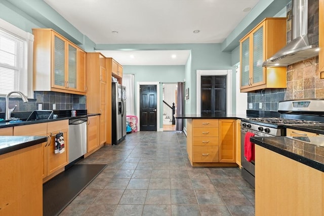 23 Gordon St, Boston, MA 02134 - kitchen with appliances with stainless steel finishes, wall chimney exhaust hood, a sink, a peninsula, and tasteful backsplash