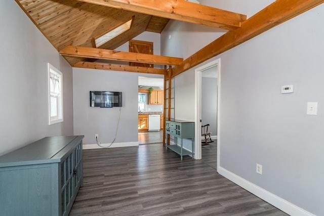 unfurnished living room featuring beamed ceiling, dark wood-type flooring, high vaulted ceiling, and a skylight