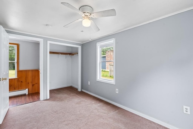 24 Horton Rd, Orange, MA 01364 - unfurnished bedroom featuring a baseboard heating unit, carpet floors, a closet, a ceiling fan, and crown molding