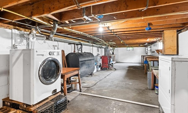 24 Horton Rd, Orange, MA 01364 - unfinished basement featuring oil tank and washer / clothes dryer