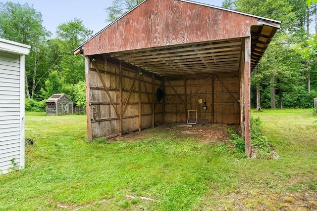24 Horton Rd, Orange, MA 01364 - view of pole building featuring a lawn and a detached carport