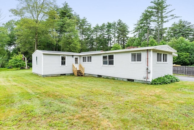 24 Horton Rd, Orange, MA 01364 - rear view of house with view of scattered trees
