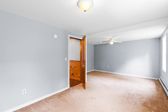 24 Horton Rd, Orange, MA 01364 - empty room with light colored carpet, a ceiling fan, a baseboard heating unit, and a smoke detector