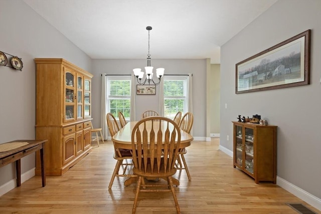1 Windsor Rd, Shirley, MA 01464 - dining area with a chandelier and light wood-type flooring