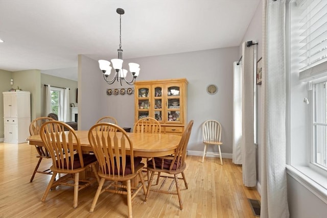 1 Windsor Rd, Shirley, MA 01464 - dining room with light wood-style floors and a chandelier