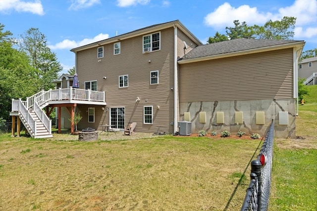 1 Windsor Rd, Shirley, MA 01464 - rear view of house with a fire pit, stairway, a deck, and a lawn
