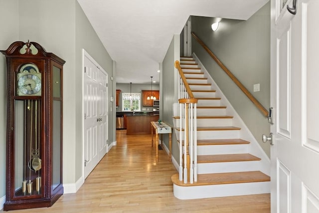 1 Windsor Rd, Shirley, MA 01464 - entryway with light wood-type flooring and stairs