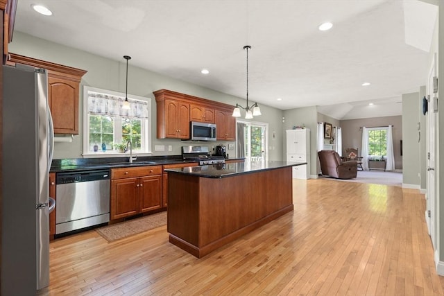 1 Windsor Rd, Shirley, MA 01464 - kitchen with appliances with stainless steel finishes, a kitchen island, open floor plan, light wood-style floors, and brown cabinetry